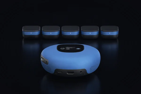A pebble-shaped assistant seen from behind, facing a row of five small compute modules
